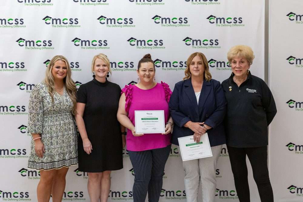 group of music teachers accepting award