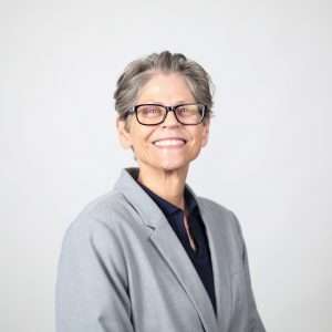 Kim Hass in grey suitcoat