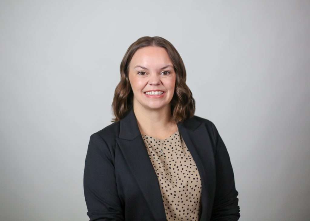 amanda woodard smiling in black jacket