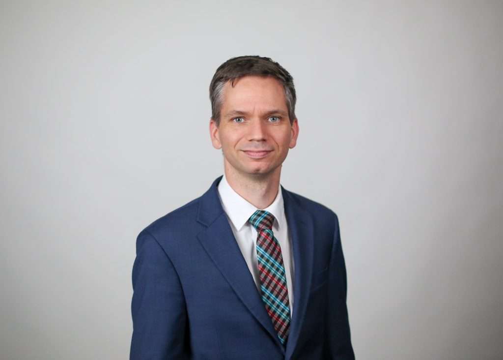 christopher bergeron smiling in blue suit