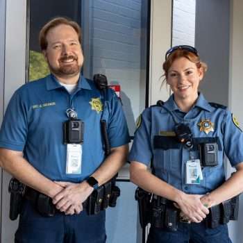 two SRO officers outside school