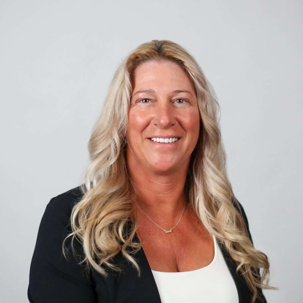 woman blond hair black blazer blank background