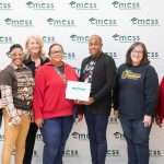 Group of people with point of pride award