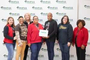 Group of people with point of pride award