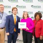 Group of people with point of pride award