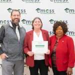 Group of people with point of pride award