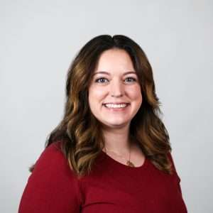 Brown haired woman with red shirt