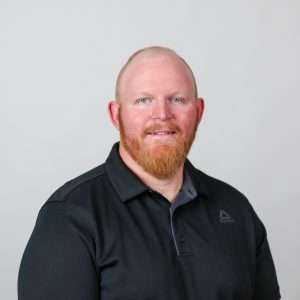 Man with red beard in black shirt