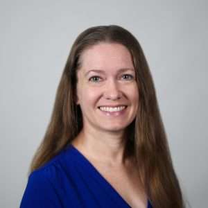 Headshot of Karla Luce (woman in blue shirt)