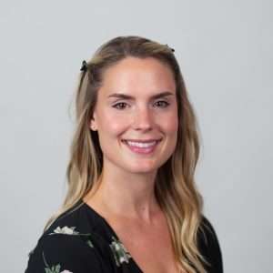 Headshot of Steffi Deates(blond woman in black shirt)