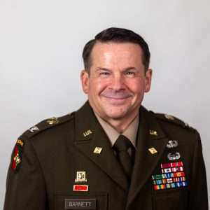 Headshot of Col Leslie Barnett (man in military uniform)