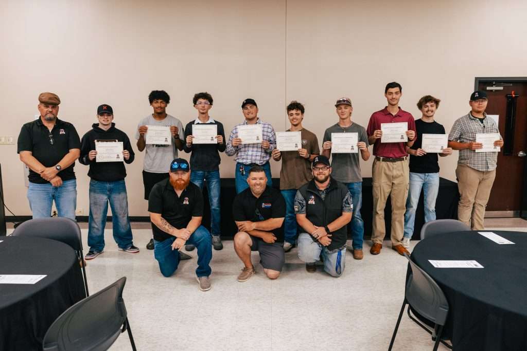 Photo of cdl program graduates and their instructors