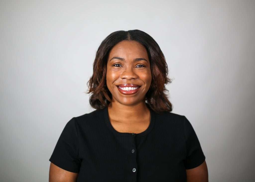 woman black shirt smiling