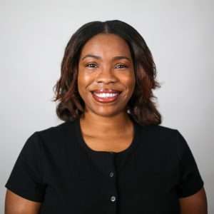 woman smiling in black shirt