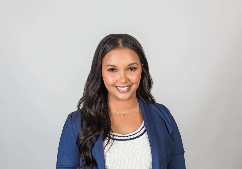 woman blue jacket white shirt